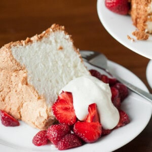 homemade angel food cake with strawberries and whipped cream.