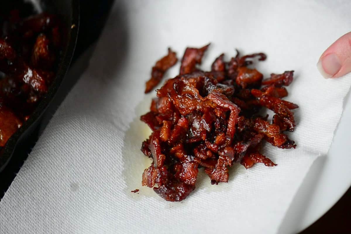 draining bacon ends and pieces on paper towel.