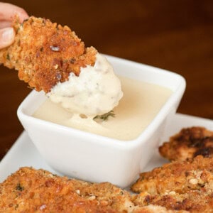 pretzel coated chicken tenders with warm cheddar cheese sauce.