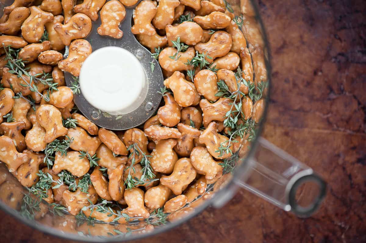 goldfish pretzel crackers with fresh thyme in food processor.