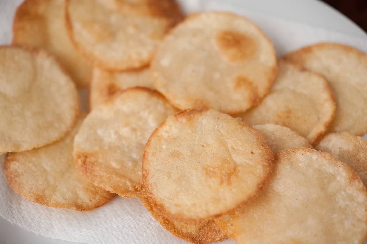 small round corn tortillas that have been fried.