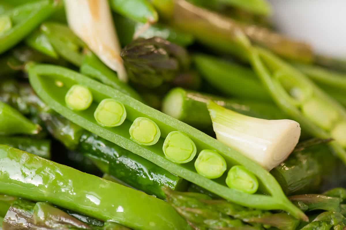 sauteed pea pods, asparagus, and garlic scapes.