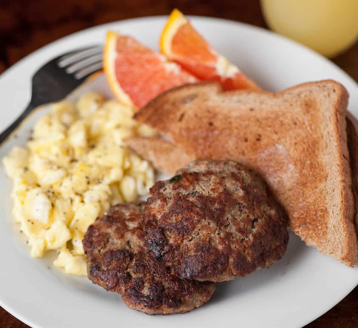 homemade breakfast sausage on plate with eggs