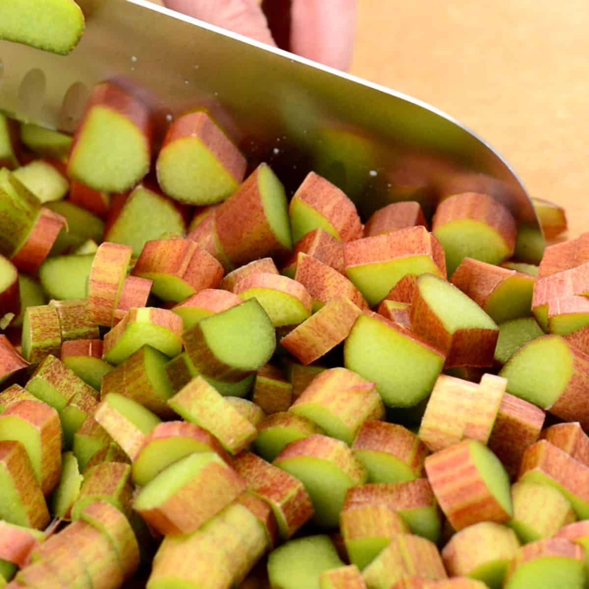 chopped rhubarb on a cutting board for strawberry rhubarb jam
