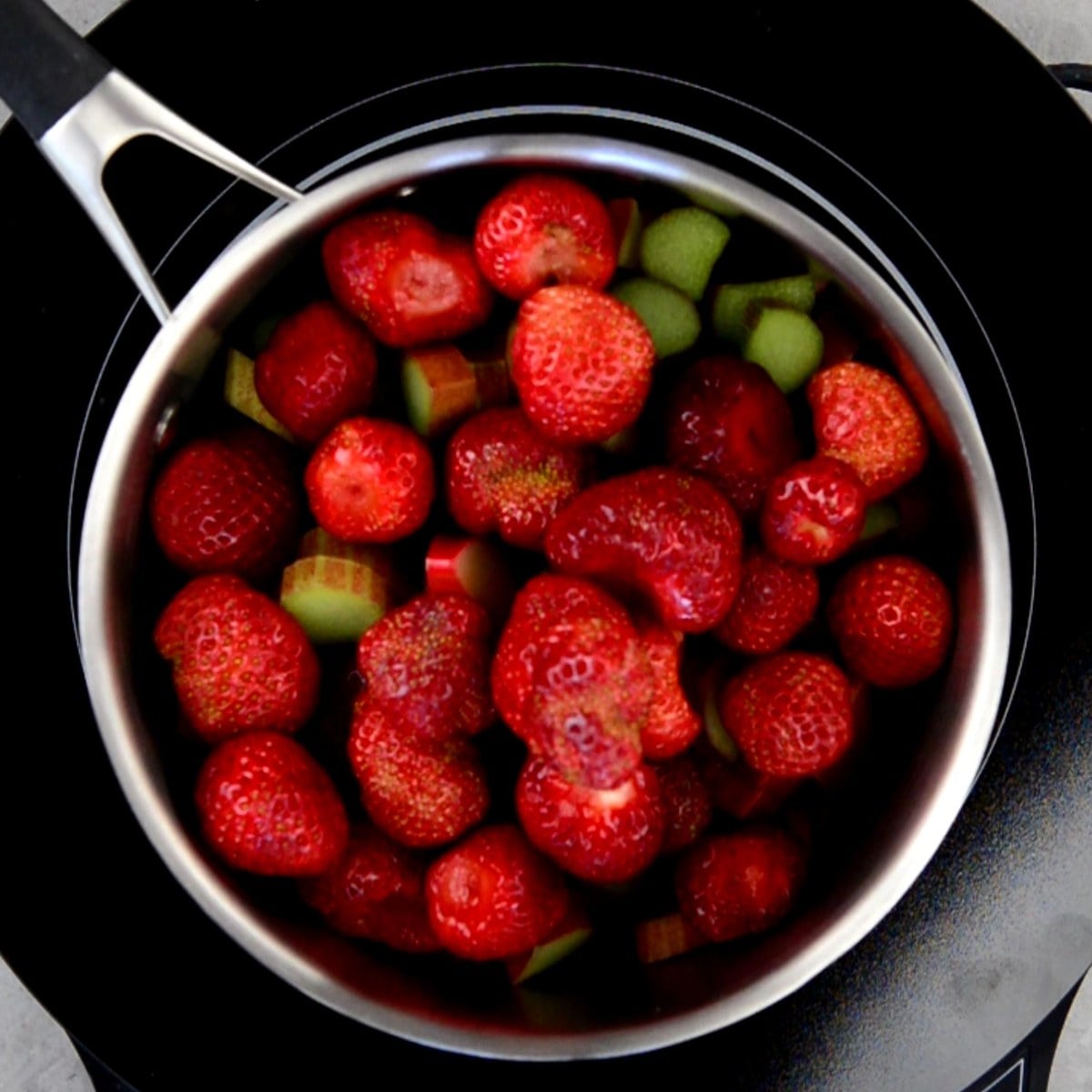 strawberries and rhubarb in a saucepan