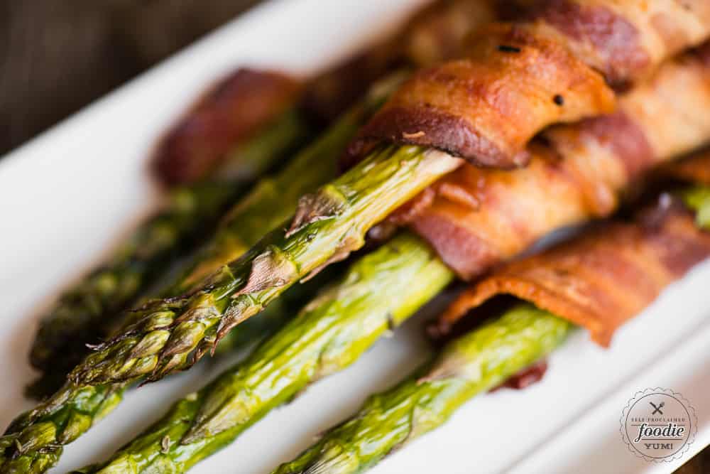 A close up of bacon wrapped asparagus