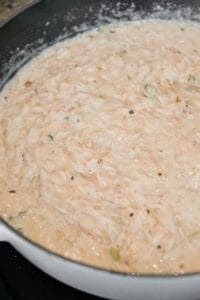 rice cooking in cream sauce