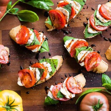 Caprese bruschetta with tomatoes on the side