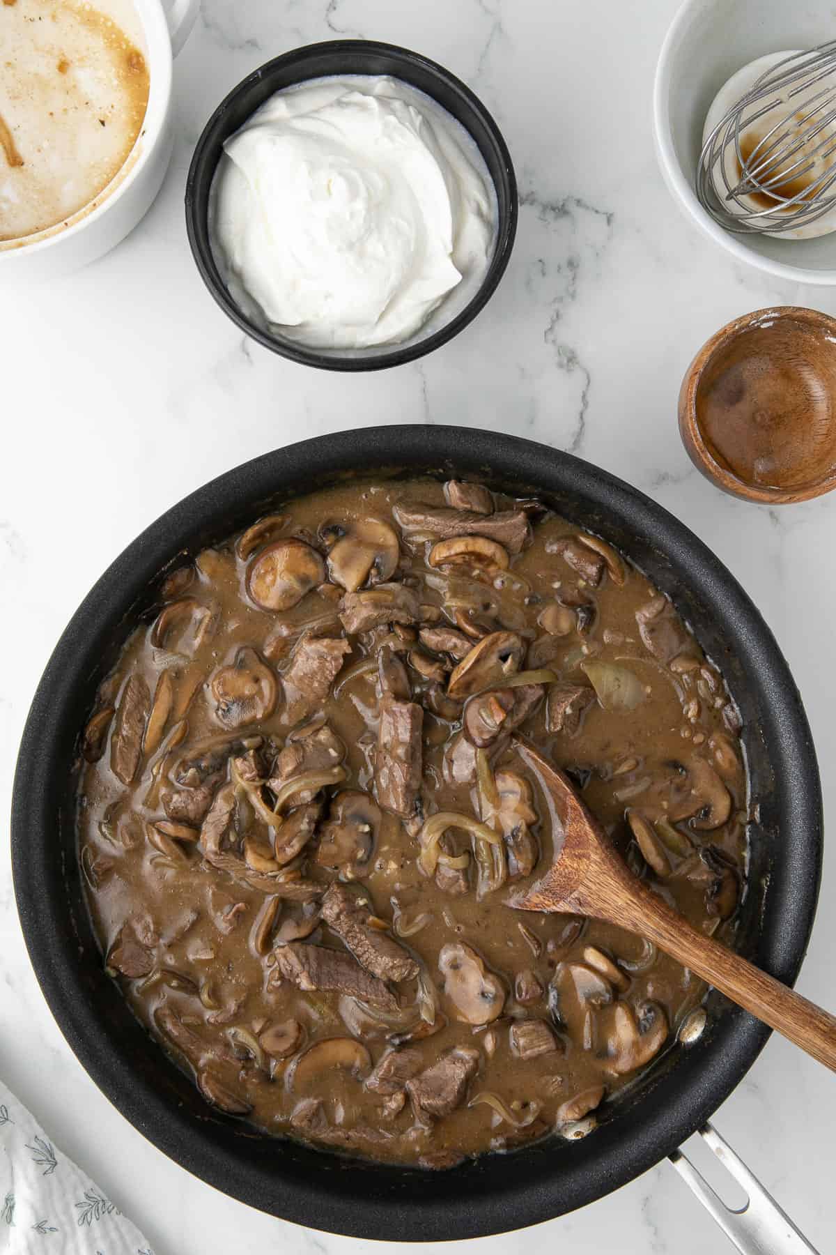 mushrooms and sliced steak for beef stroganoff recipe.