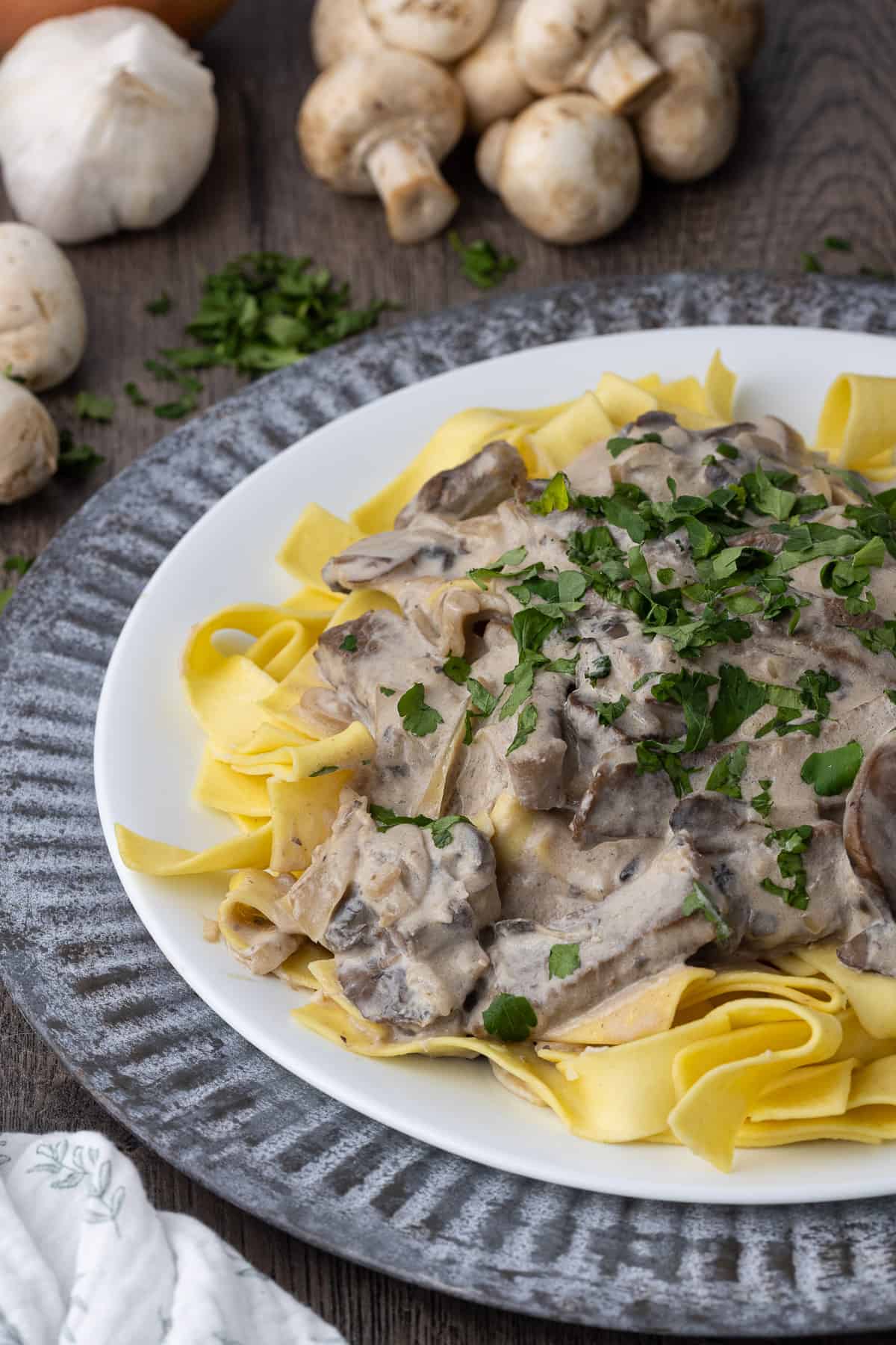 beef stroganoff with mushrooms and gravy over noodles.