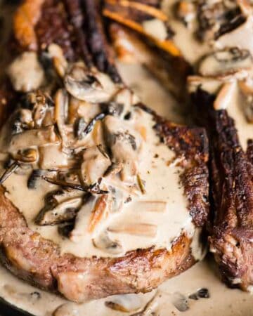 Pan Seared Ribeye Steak with Creamy Mushroom Sauce unites the most tender and flavorful cut of beef with a rich savory finish. It's the kind of meal you crave. This is also the best dinner to explore the perfect wine pairing. Is there anything better than a buttery steak smothered in sauce?