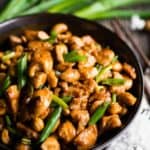 Cashew Chicken in bowl with chopsticks