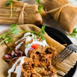 homemade authentic pork tamales wrapped in corn husks