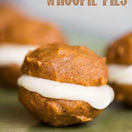 Pumpkin Whoopie Pies, made with super soft homemade pumpkin cookies and maple cream cheese filling, are the perfect fall two-bite dessert!
