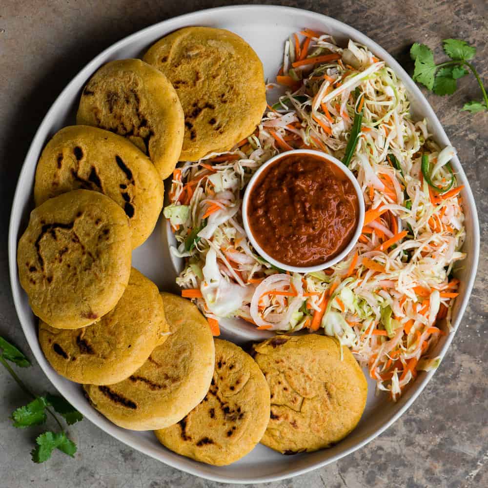 homemade pupusas with curtido and salsa roja