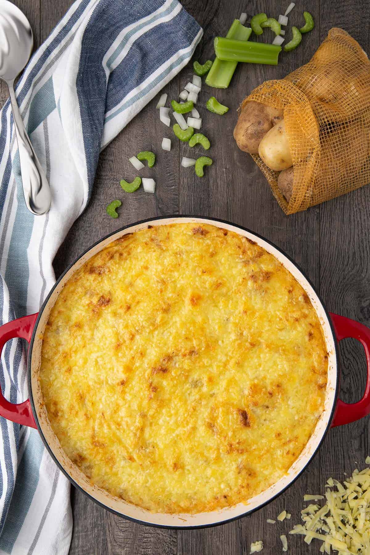 casserole dish with cheese covered mashed potatoes