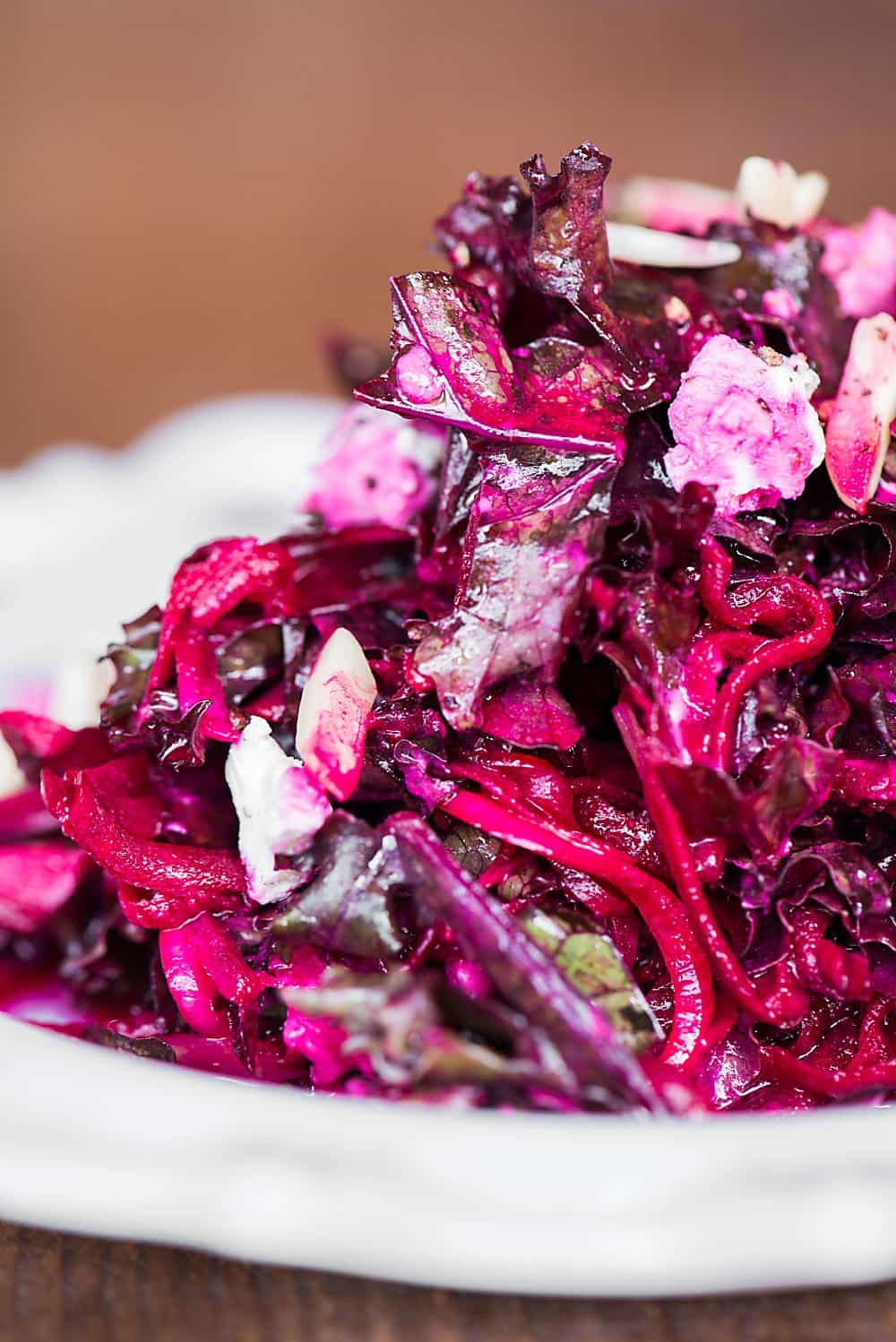 A close up of shredded beet and kale salad