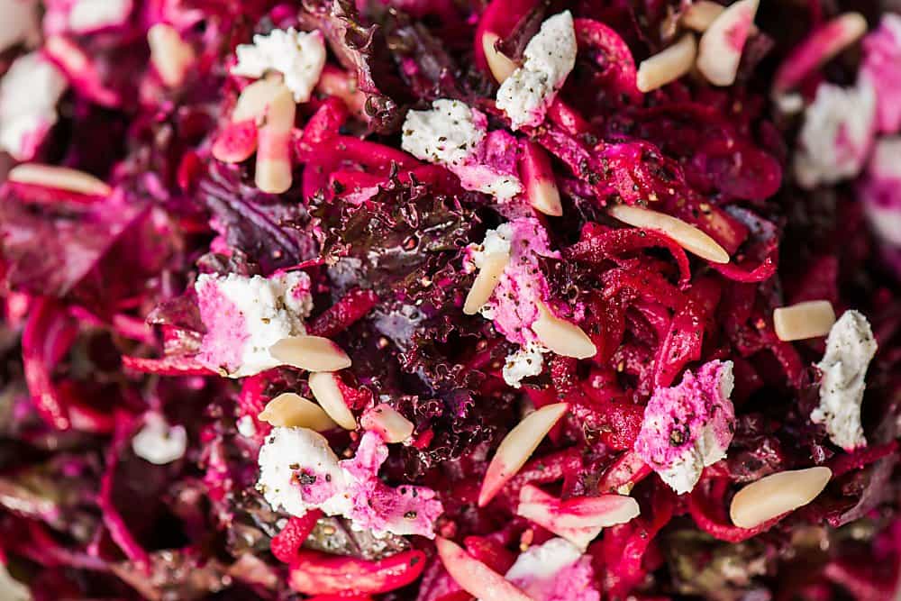 A close up of beet and kale salad