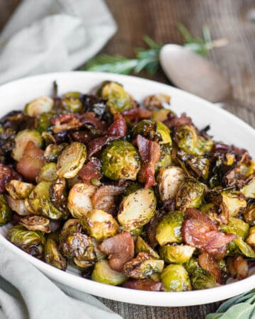 air fried brussels sprouts and bacon on white oval dish