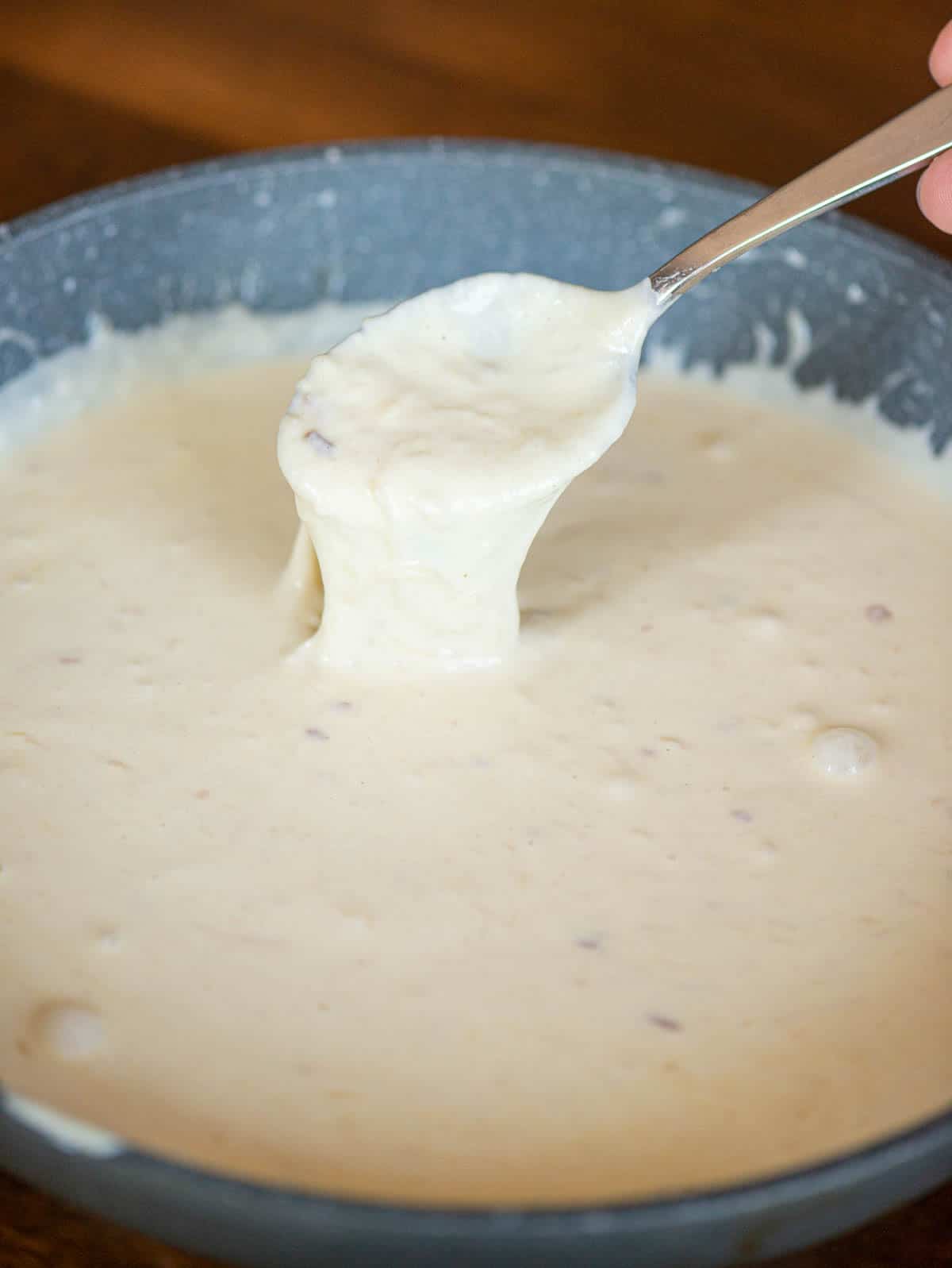 Homemade Alfredo Sauce in pan.