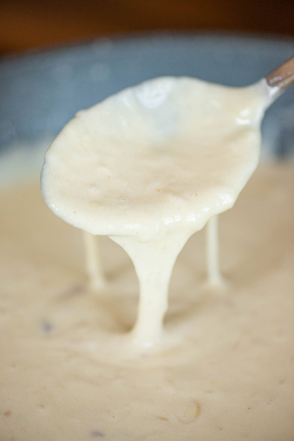 spoonful of homemade garlic infused creamy Alfredo sauce.