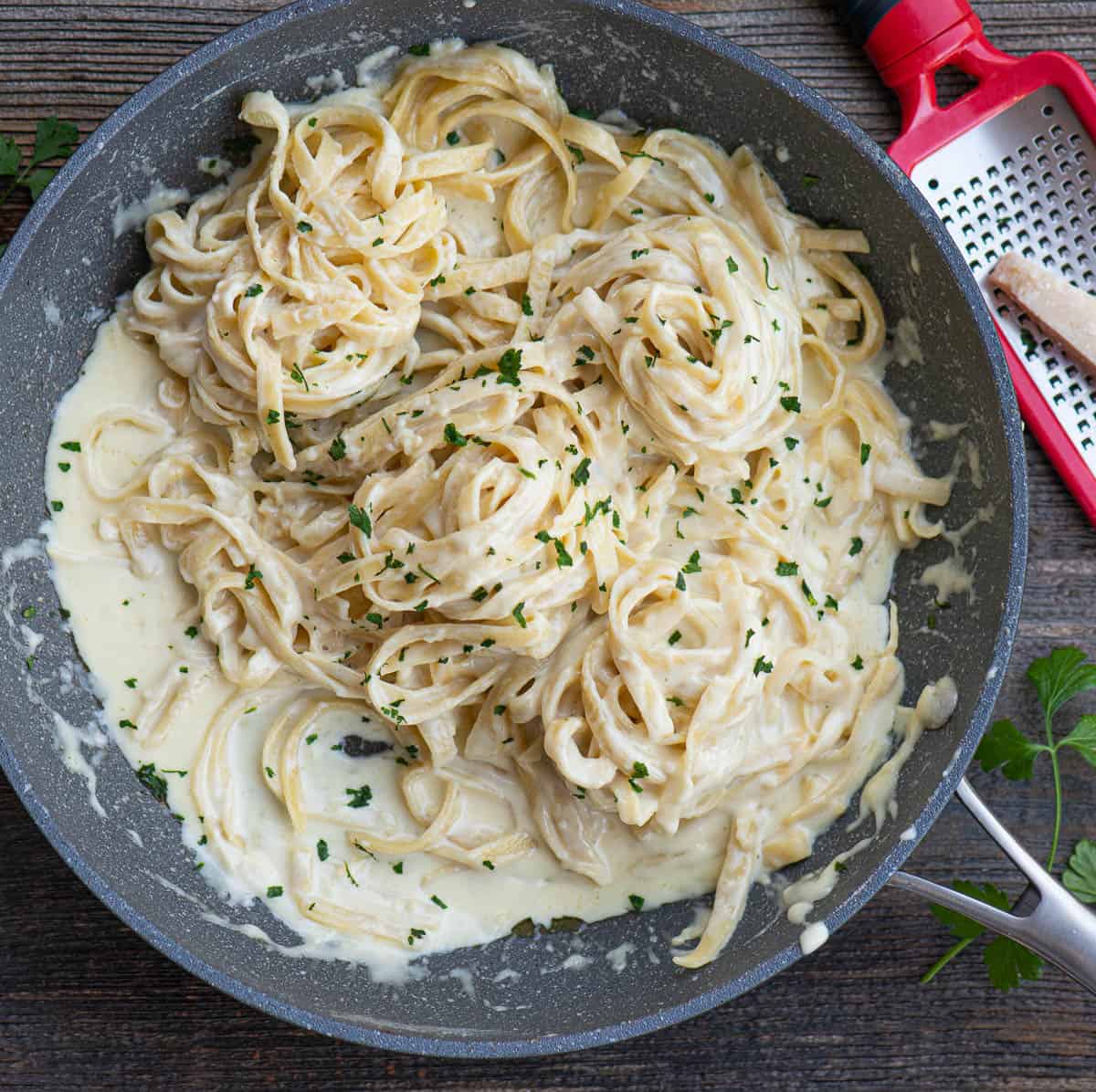 Homemade fettucine Alfredo in pan.