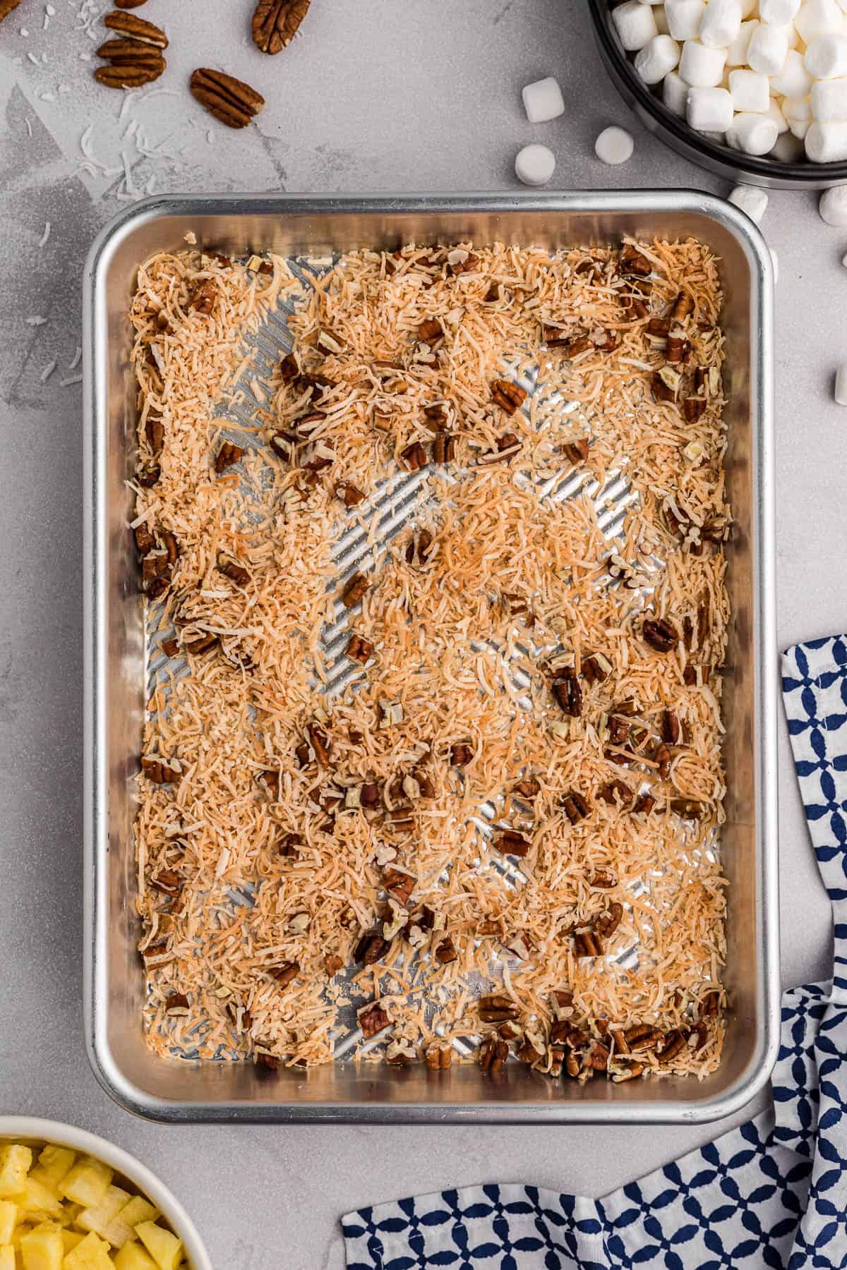 toasted pecans and shredded coconut on baking sheet.