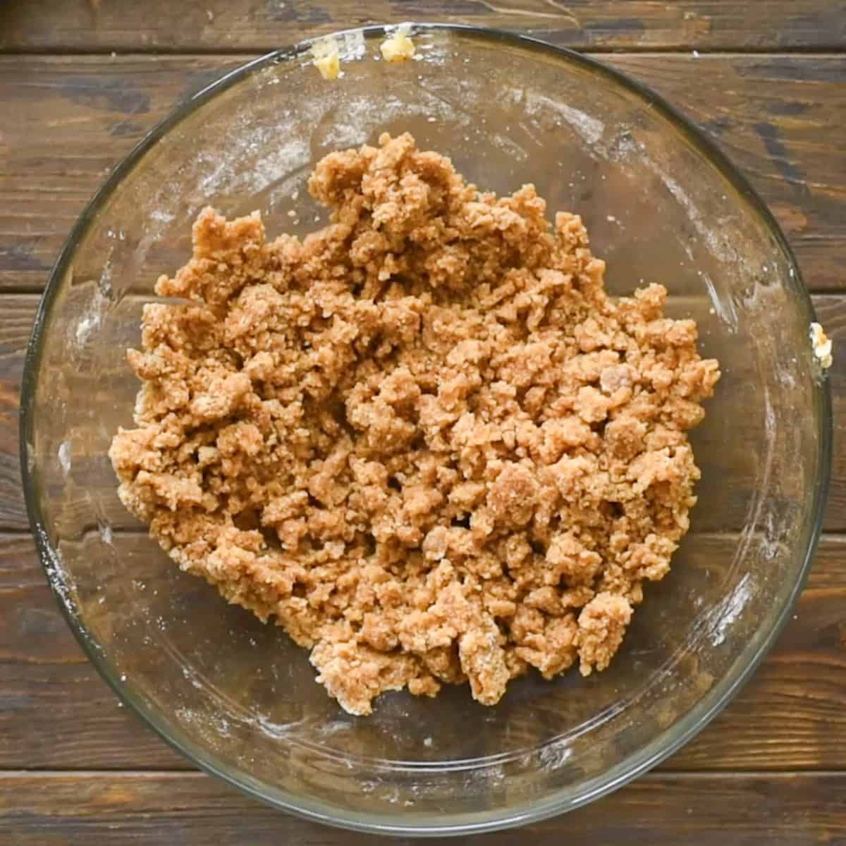 Crumb topping mixture for apple brown betty recipe in glass bowl.