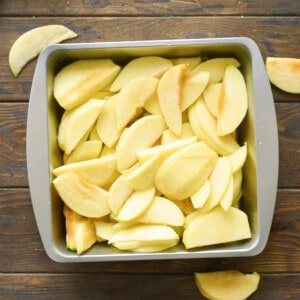 Sliced apples in 9x9 baking dish.