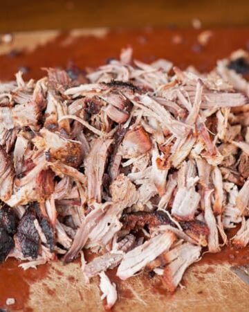 Nothing says summer like some outstanding Apple Cider Barbecue Pulled Pork. Its so tender from the brine and flavorful from the dry rub & slow cooking.