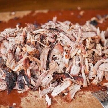 Nothing says summer like some outstanding Apple Cider Barbecue Pulled Pork. Its so tender from the brine and flavorful from the dry rub & slow cooking.