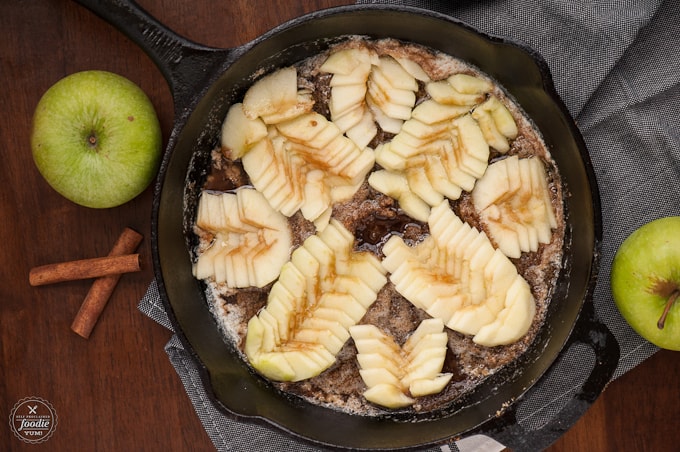 apples in cast iron skillet for apple cake recipe