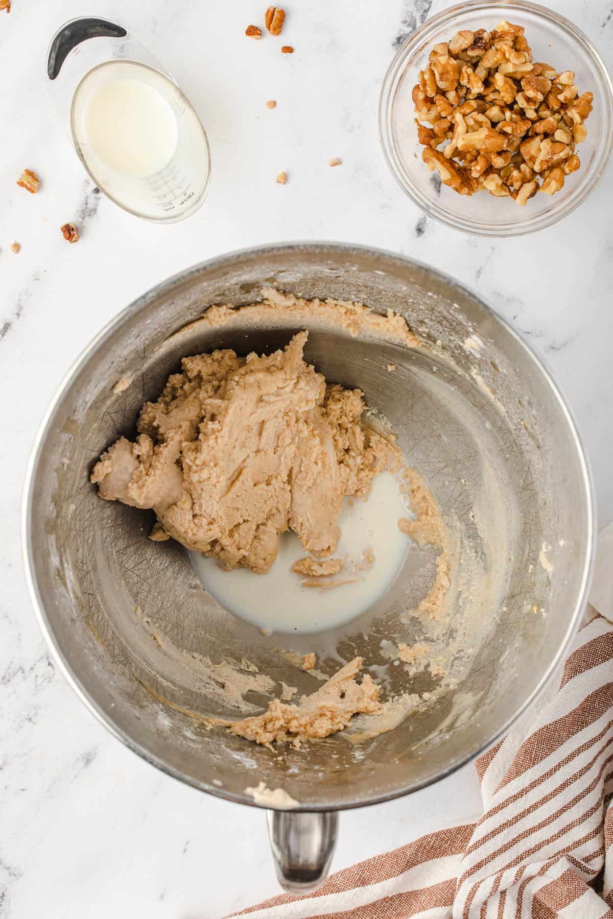 brown butter frosting in mixing bowl