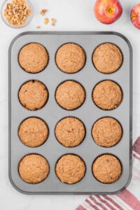 12 applesauce muffins in muffin tin.