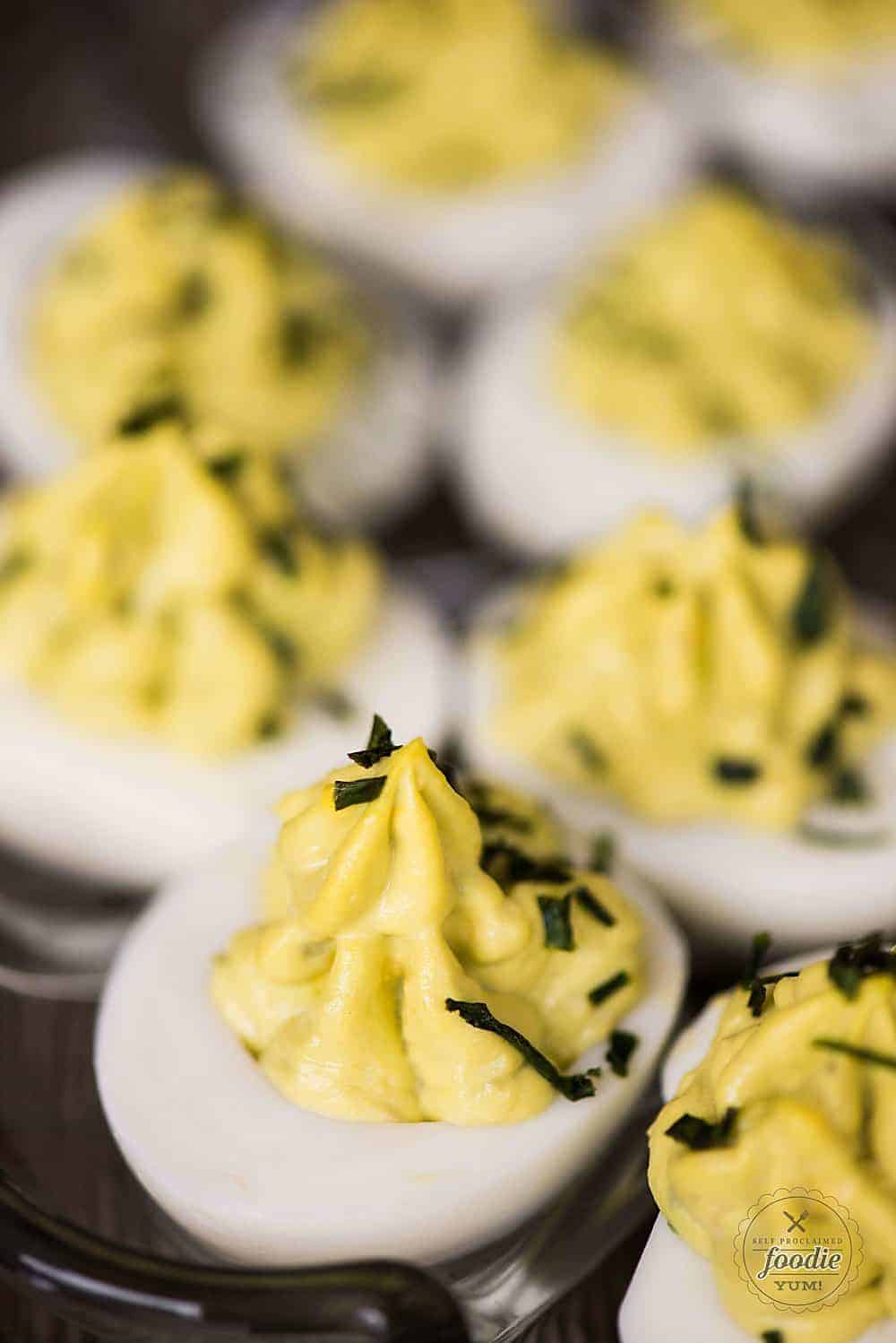 Avocado Deviled Eggs are a healthy spin on classic deviled eggs. Great for parties or a protein filled keto-friendly snack - you'll love them!