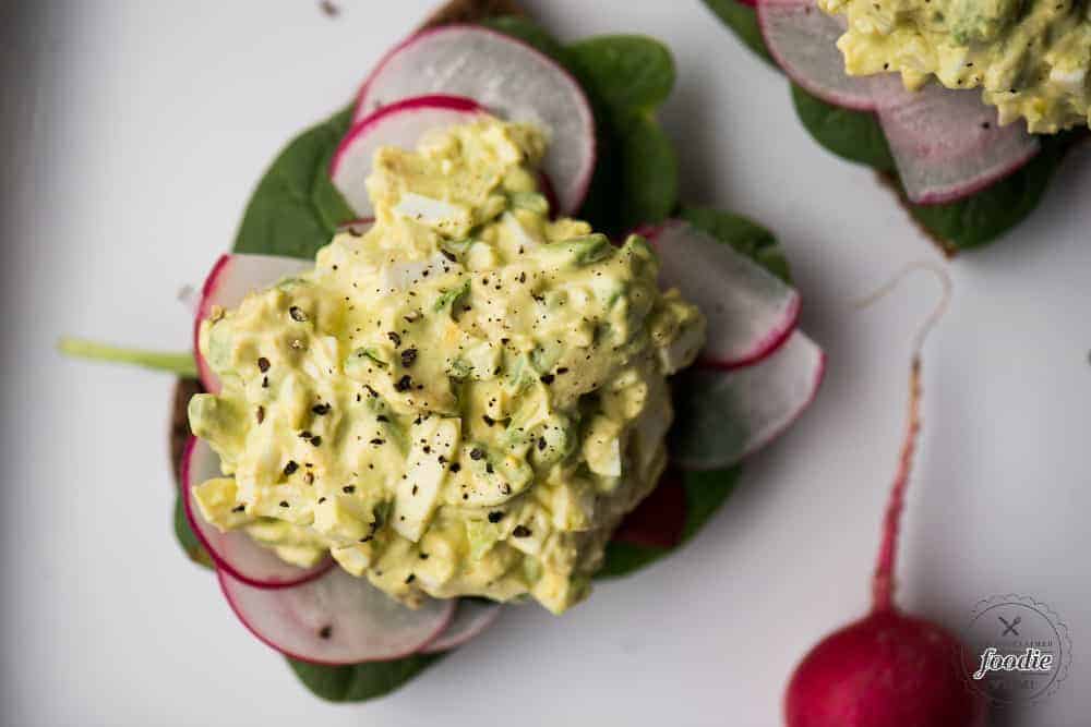 avocado egg salad on toast with vegetables