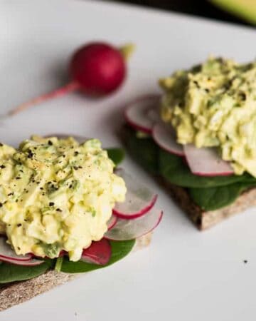Avocado Egg Salad combines creamy mashed avocado with traditional egg salad for a delicious quick and easy lunch. If you love avocado on toast, but also love the flavor of egg salad, then this recipe is for you. Make a big batch and have lunch ready to go for the whole week!