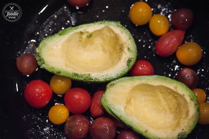 avocado halves with cherry tomatoes