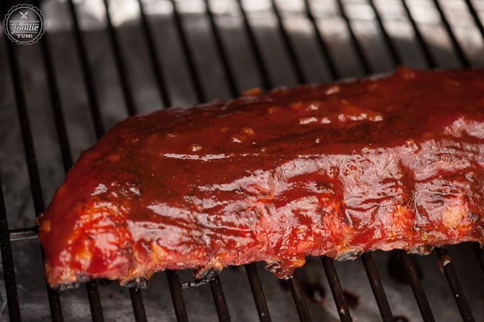 pork ribs with barbecue sauce on grill