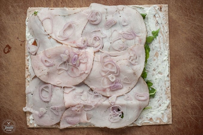 making a turkey pinwheel roll up sandwich