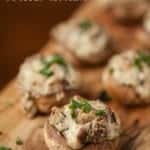 bacon blue cheese stuffed mushrooms on a cutting board