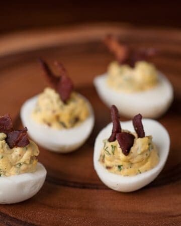 Bacon Jalapeño Deviled Eggs are a spicy two bite appetizer that people love, especially as game day grub or during a party.