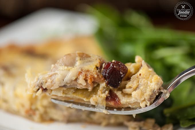 a bite of bacon mushroom Quiche Lorraine on fork