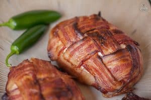 Because bacon makes everything better, enjoy grilling or baking this 4 ingredient Bacon Wrapped Jalapeno Popper Chicken for dinner or a game day feast.