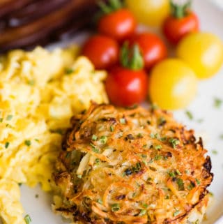 breakfast with baked parmesan hashbrowns eggs tomatoes bacon