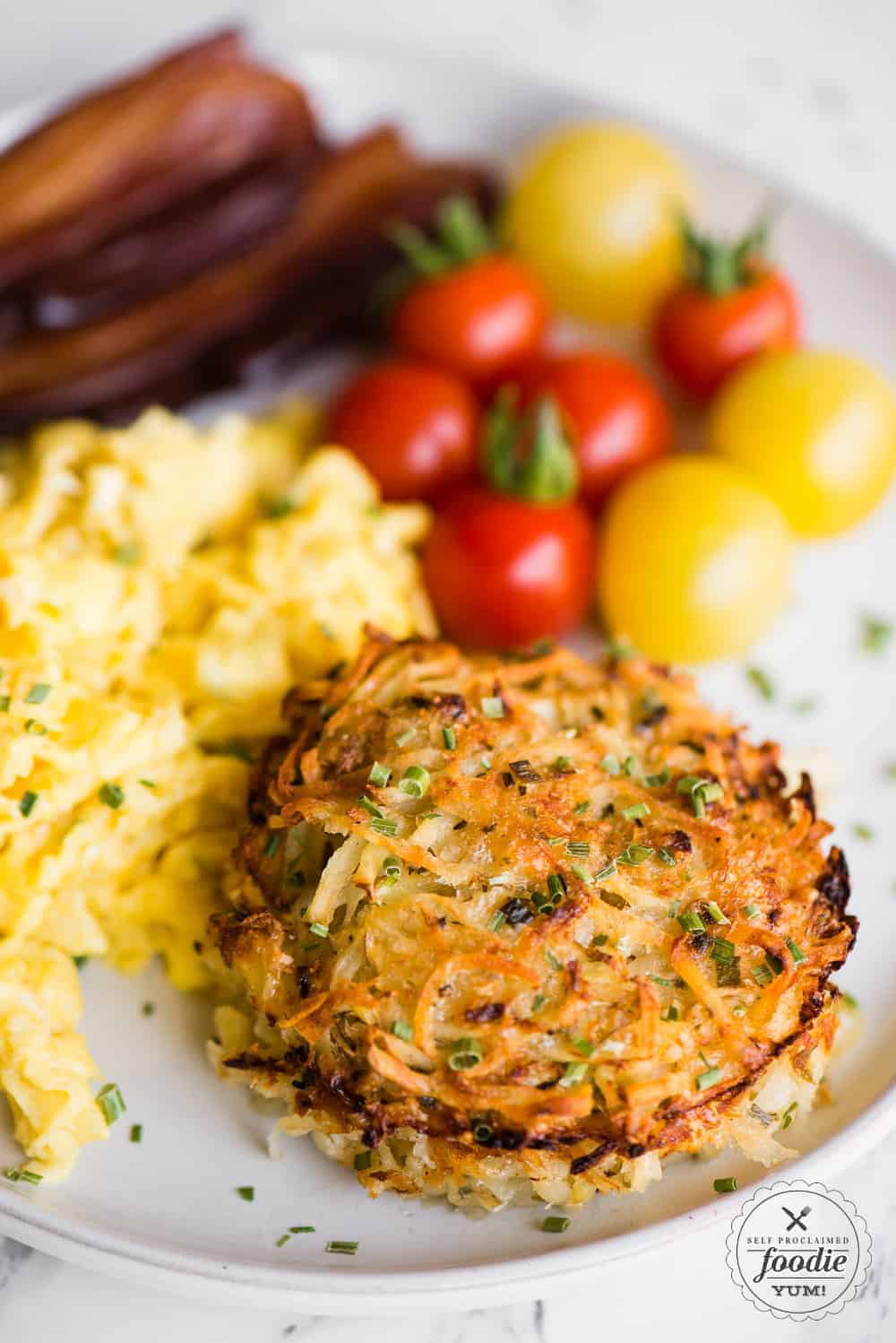 breakfast with baked parmesan hashbrowns eggs tomatoes bacon