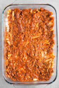 italian sausage and marinara sauce over ziti pasta