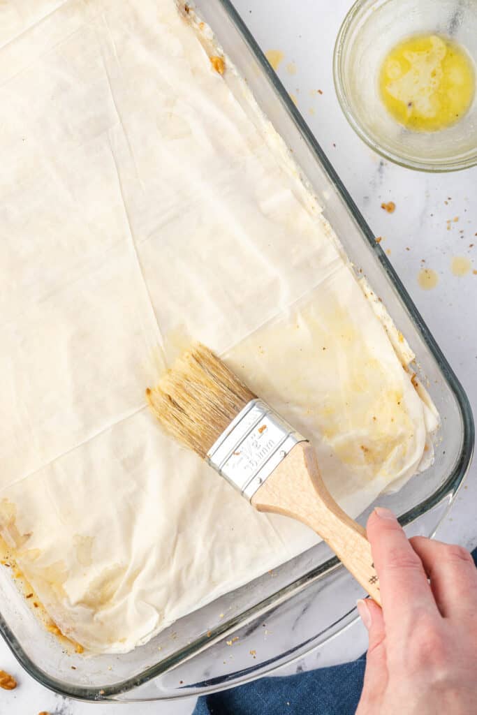 painting butter on filo dough