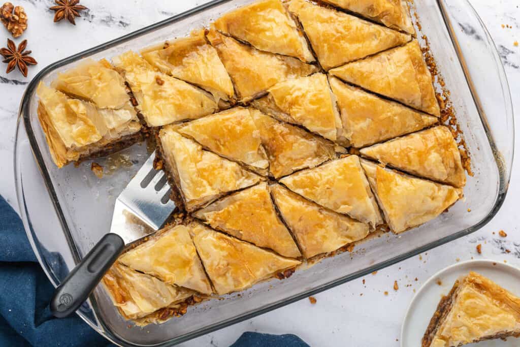 pan of Baklava with piece cut out