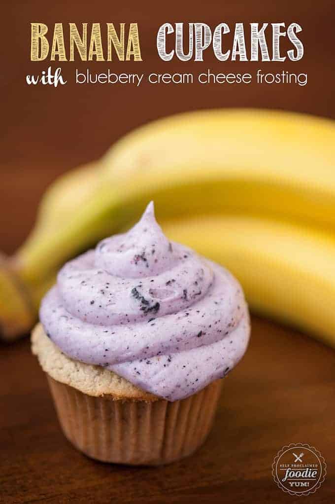 a cupcake with blueberry frosting with bananas